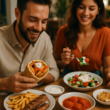 A spread of Greek cheat meals including souvlaki, gyros, and Greek salad on a wooden table